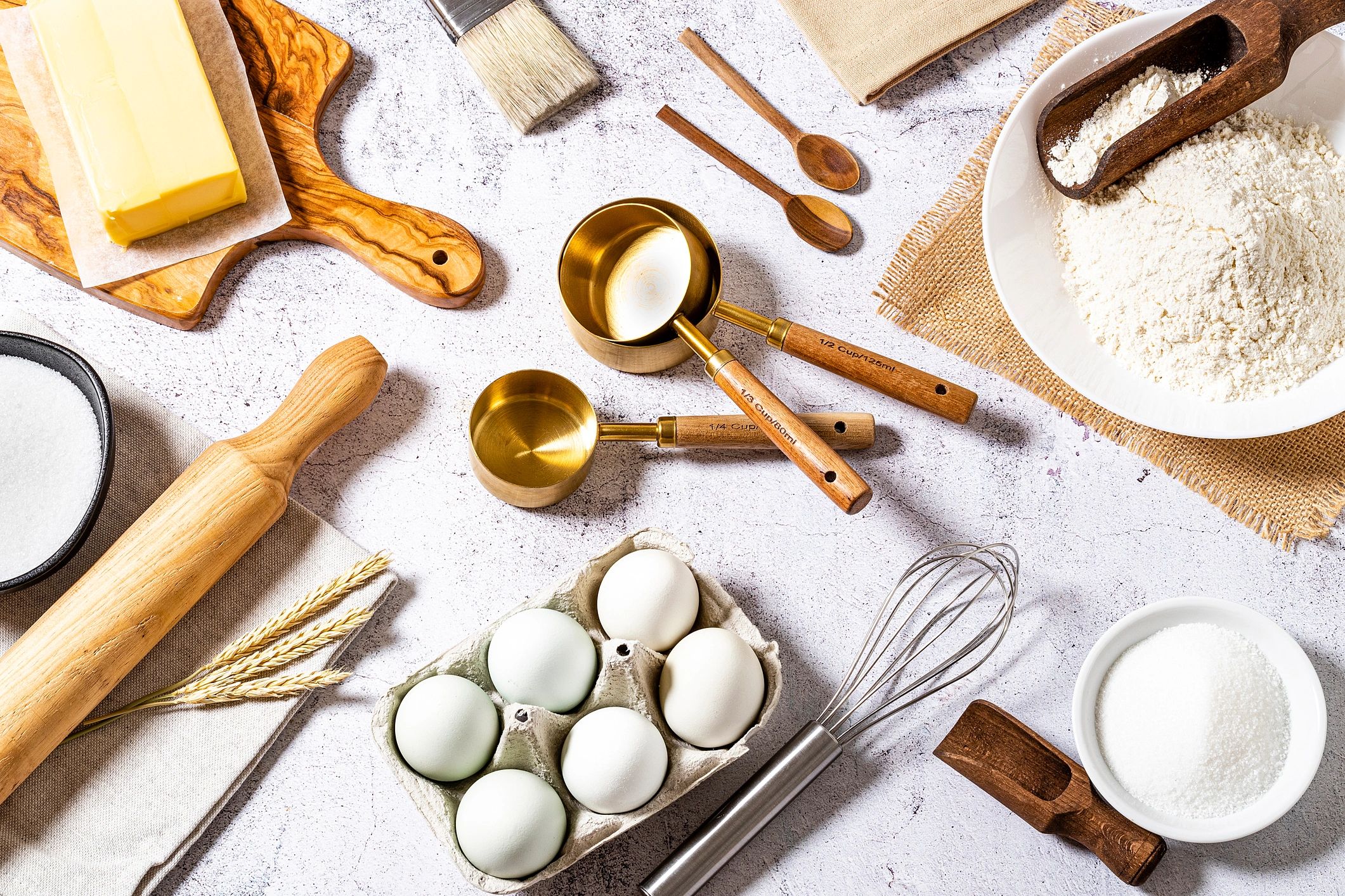Artisan baking ingredients like chocolate, butter, and eggs